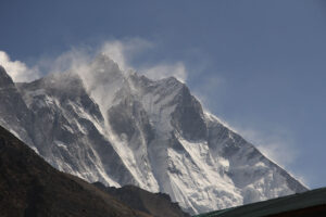 The wind blowing snow over the peaks in Sagarmatha National Park, Nepal.