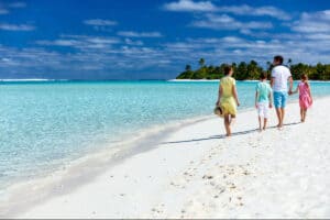 family on beach in hawaii.