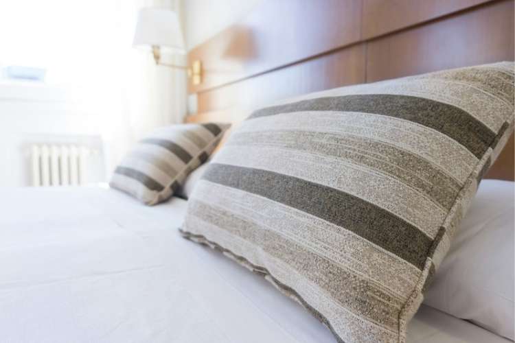 Plush hotel pillows on a bed