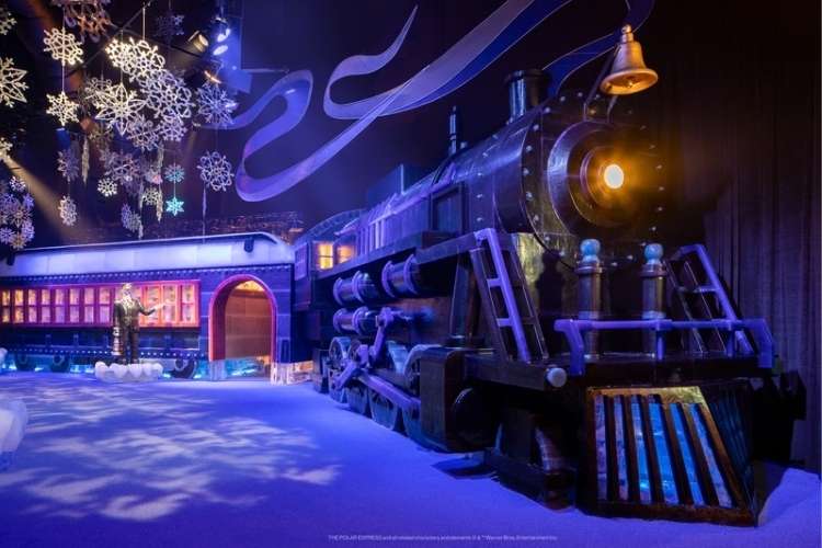 Passengers boarding the Polar Express train, capturing the festive and magical atmosphere.