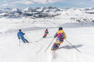 Three Skiiers. Photo by Banff Sunshine Village, Unsplash