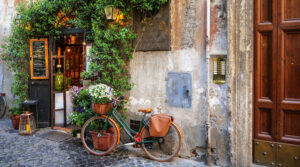 Bike learning against a wall in a scenic photo of Rome. Photo by iStock