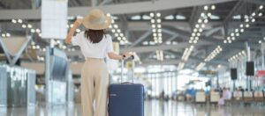 Woman at the airport. Photo by Panuwat Dangsungnoen, iStock