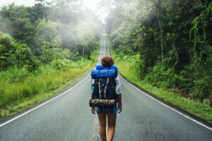 Woman traveler. Photo by Unsplash +